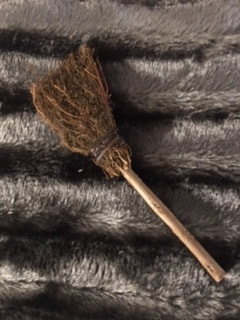 Small besom used to cleanse a ritual space. 
